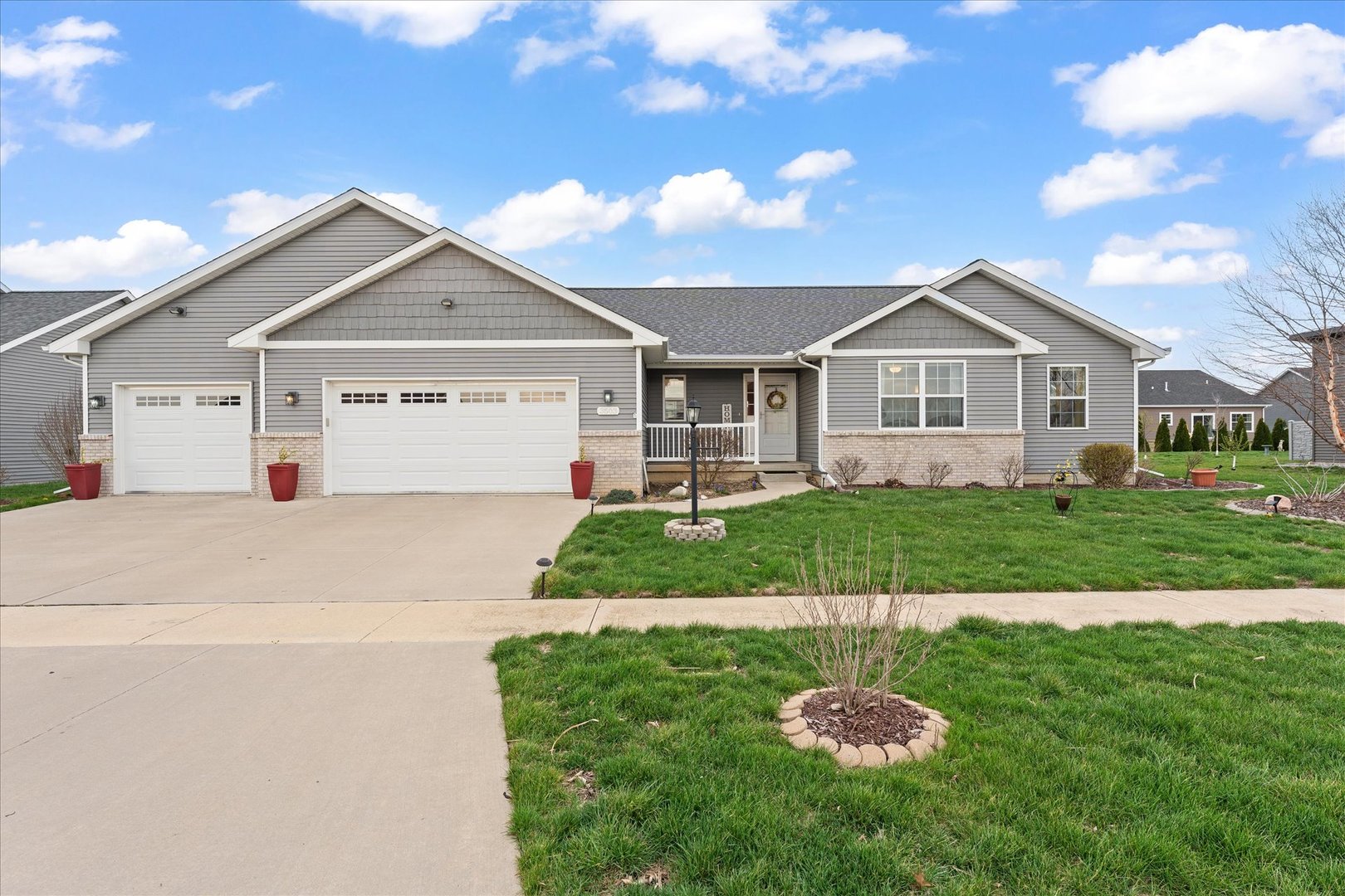 3503 South Deer Ridge Drive Urbana, IL 61802 - Photo 47 of 51 a front view of a house with a garden