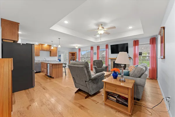 a living room with furniture and kitchen view