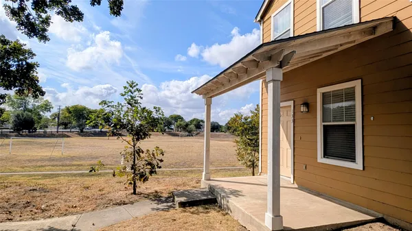 a view of a backyard of the house