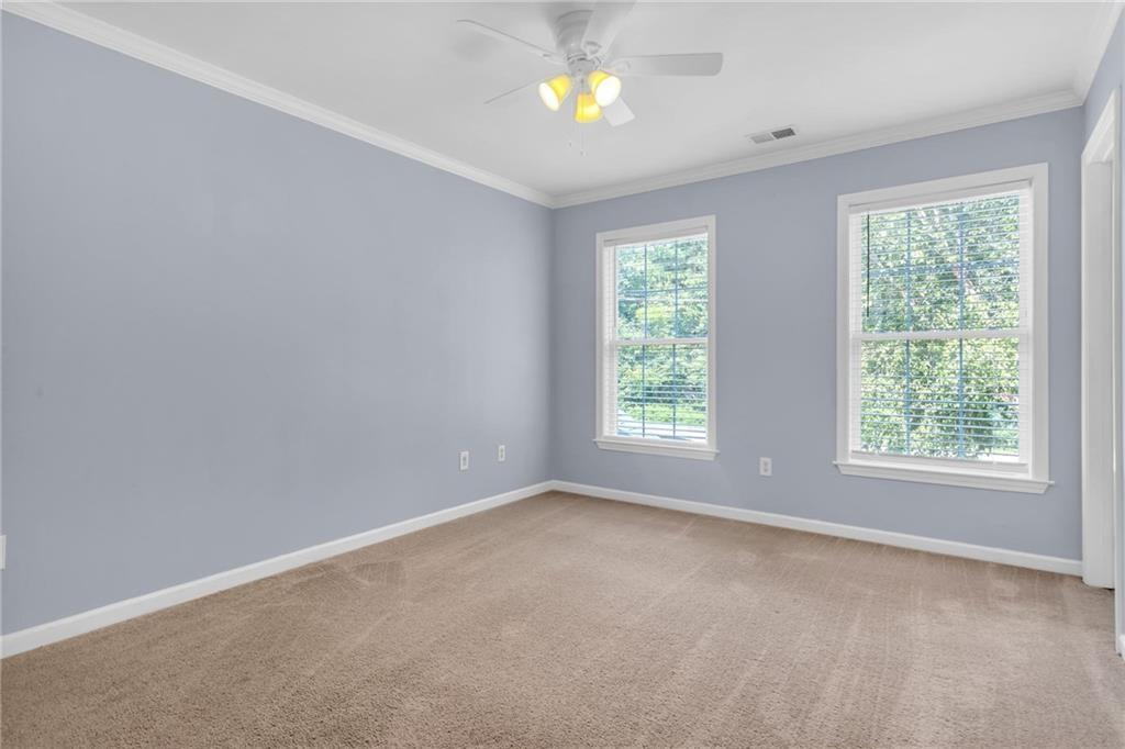 4179 Nance Road Kennesaw, GA 30144 - Photo 11 of 19 an empty room with windows and natural light