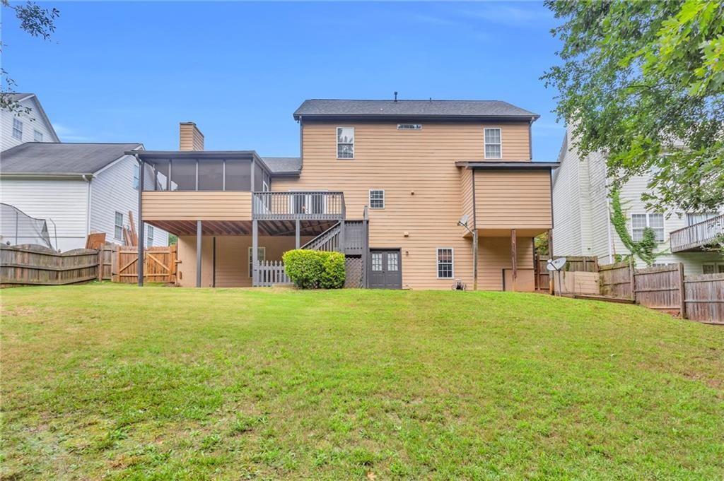 4179 Nance Road Kennesaw, GA 30144 - Photo 17 of 19 a view of a house with a yard and sitting area