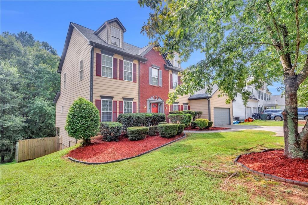 4179 Nance Road Kennesaw, GA 30144 - Photo 19 of 19 a front view of a house with a yard and trees