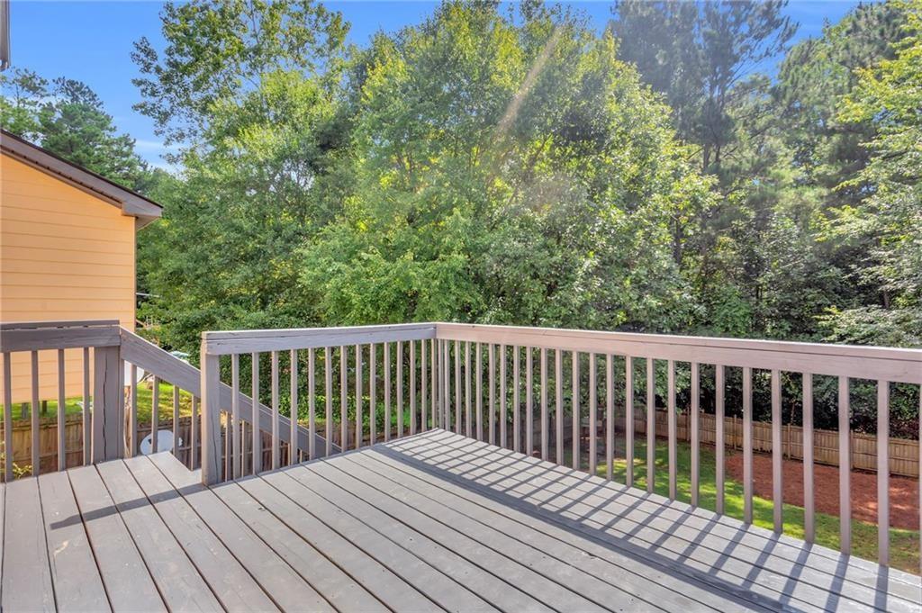 4179 Nance Road Kennesaw, GA 30144 - Photo 8 of 19 a balcony with wooden floor and fence