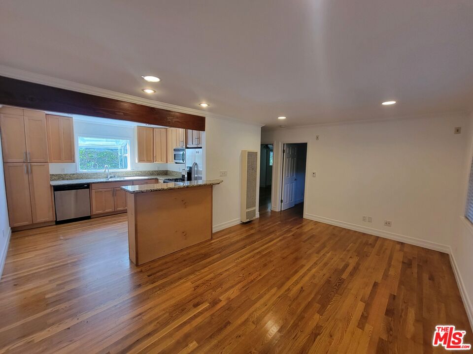 a view of kitchen with wooden floor