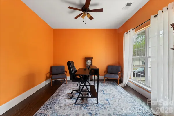 a work room with furniture and a window