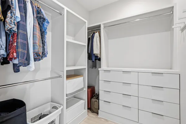 a bedroom with bed and a window