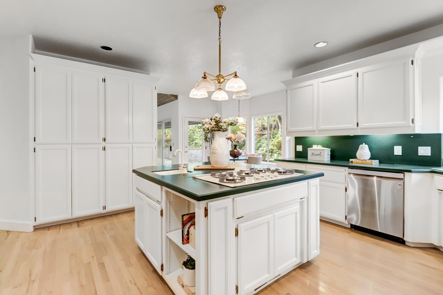 3058 Ridgeview Drive El Dorado Hills, CA 95762 - Photo 17 of 73 a kitchen with a stove and white cabinets