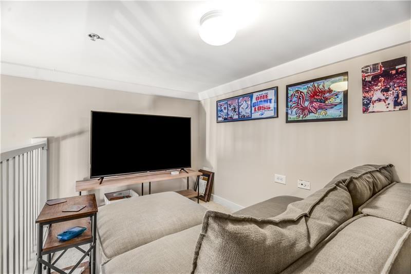 1628 Briarcliff Road Northeast, Unit 18 Atlanta, GA 30306 - Photo 12 of 25 a living room with furniture and a flat screen tv