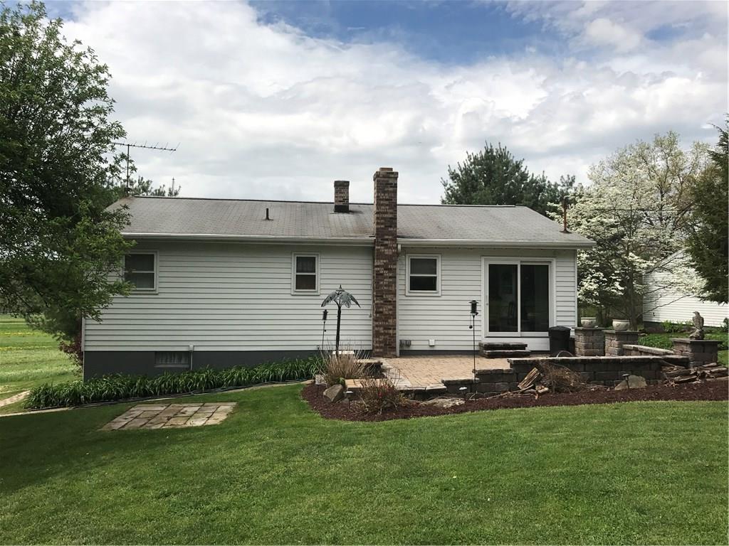 134 Glen Rape Road Rochester, PA 15074 - Photo 3 of 25 Rear view of house with stone patio and area for picnic table to the left.