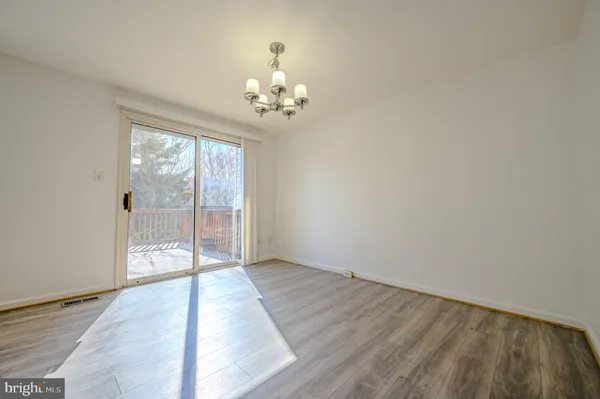 a view of an entryway with wooden floor