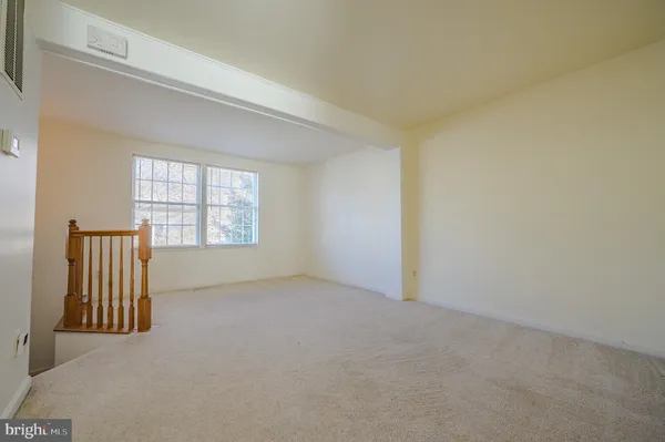 a view of a kitchen with a sink cabinets and wooden floor