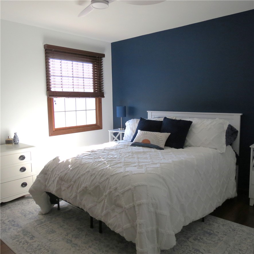 10160 Lochard Road Sidney, OH 45365 - Photo 25 of 41 This serene bedroom offers a calming retreat with ample natural light.