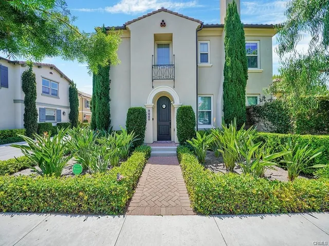front view of a house with a garden