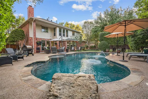 a view of a swimming pool with a patio