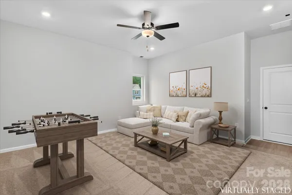 a living room with furniture and a table