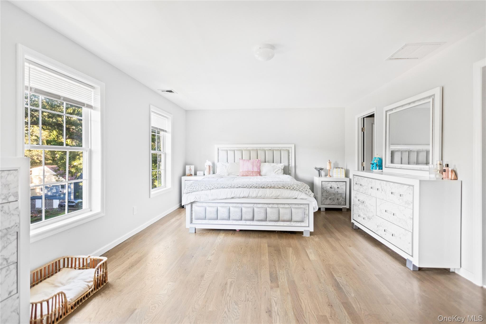 24 Belmont Road Sound Beach, NY 11789 - Photo 12 of 23 a bedroom with a bed and a large window
