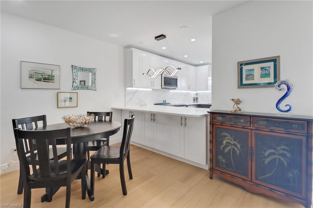 1200 Cherrystone Court, Unit A104 Naples, FL 34102 - Photo 12 of 29 Dining area featuring recessed lighting and light wood-type flooring
