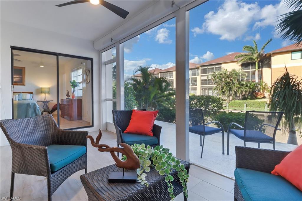 1200 Cherrystone Court, Unit A104 Naples, FL 34102 - Photo 21 of 29 Sunroom / solarium featuring a ceiling fan and an outdoor living space