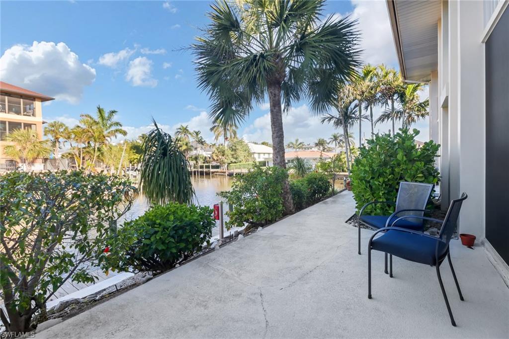 1200 Cherrystone Court, Unit A104 Naples, FL 34102 - Photo 22 of 29 View of patio with a water view