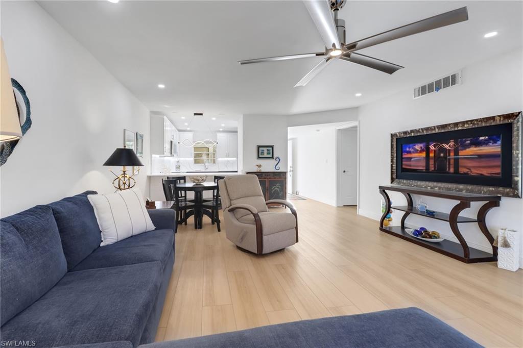 1200 Cherrystone Court, Unit A104 Naples, FL 34102 - Photo 8 of 29 Living area with light wood-type flooring, a ceiling fan, recessed lighting, and visible vents
