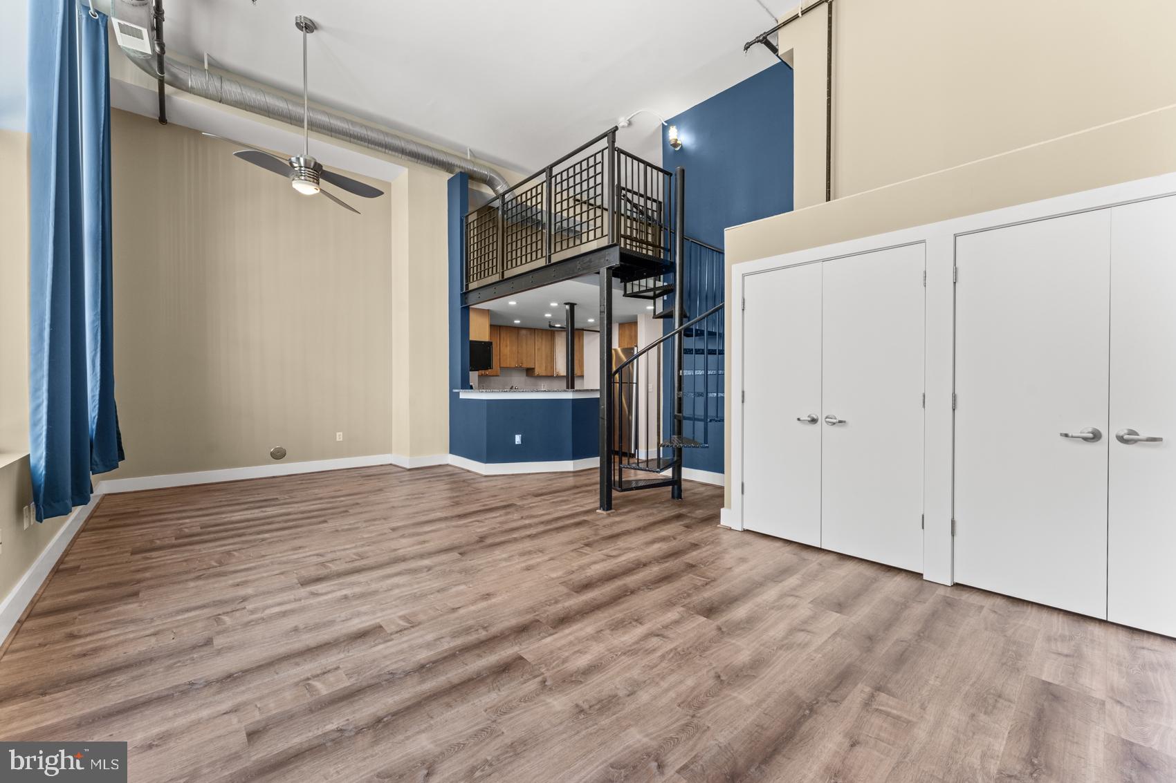 22 South Howard Street, Unit R201 Baltimore, MD 21201 - Photo 15 of 34 a view of empty room with wooden floor and fan