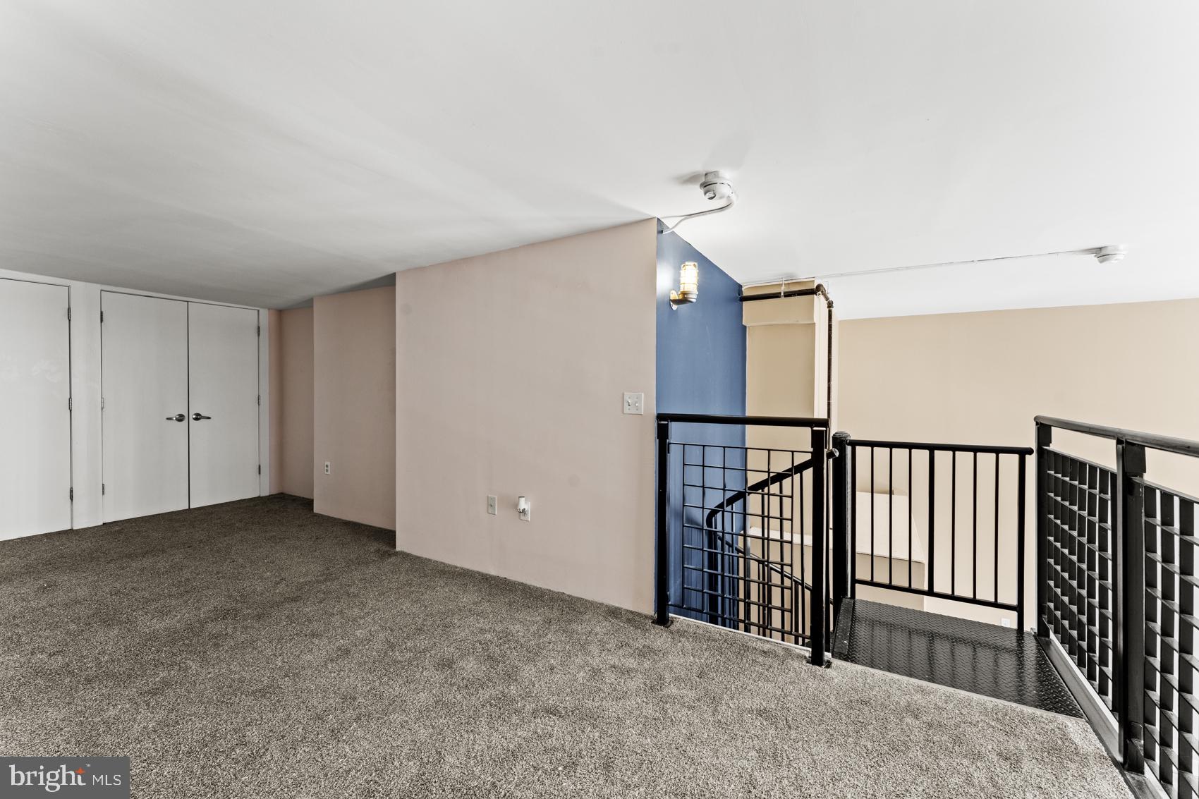 22 South Howard Street, Unit R201 Baltimore, MD 21201 - Photo 23 of 34 an empty room with windows & a ceiling fan view