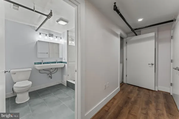 a bathroom with a tub a sink and a shower