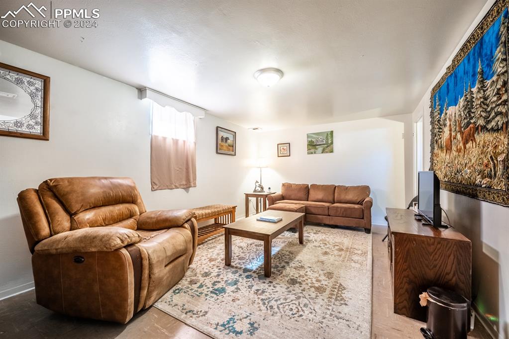 91 Duke Street Pueblo, CO 81005 - Photo 15 of 30 a living room with furniture and a rug