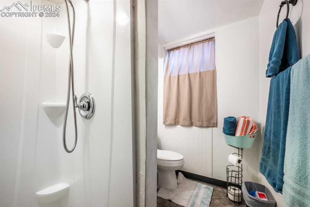 91 Duke Street Pueblo, CO 81005 - Photo 19 of 30 a bathroom with a toilet and a shower