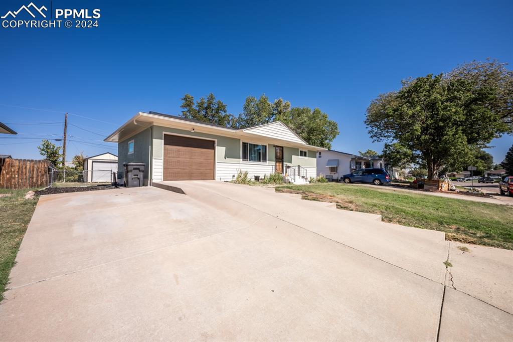 91 Duke Street Pueblo, CO 81005 - Photo 2 of 30 a view of house with a yard