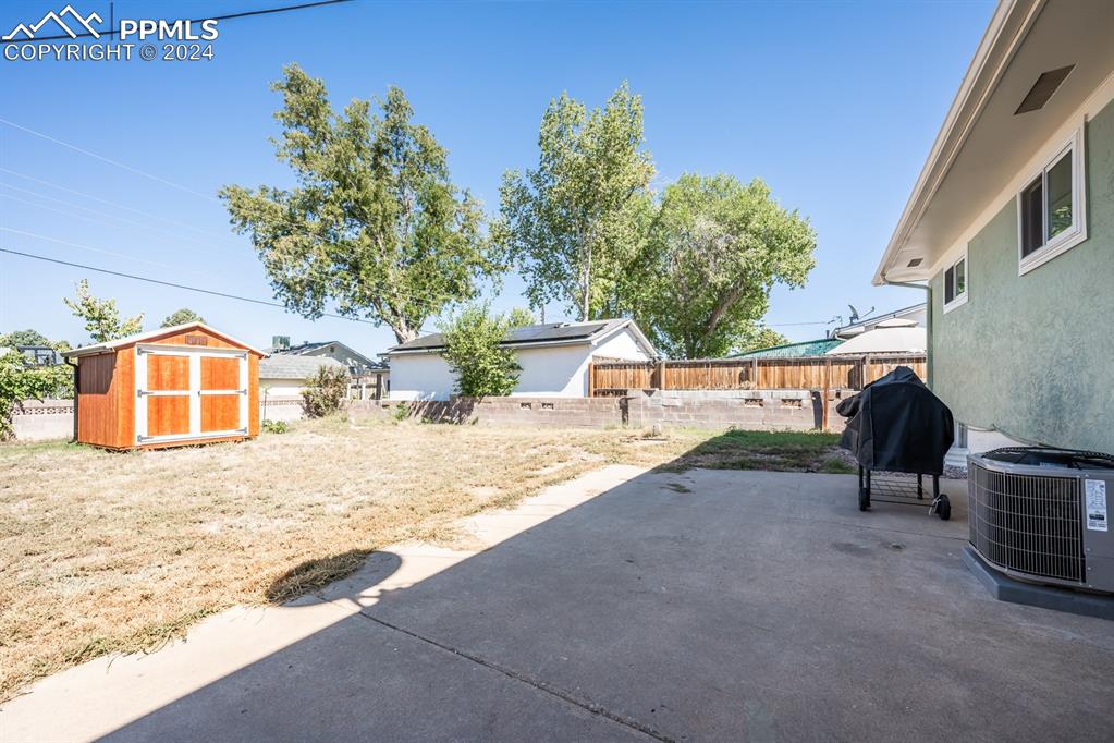 91 Duke Street Pueblo, CO 81005 - Photo 25 of 30 a view of a house with a yard