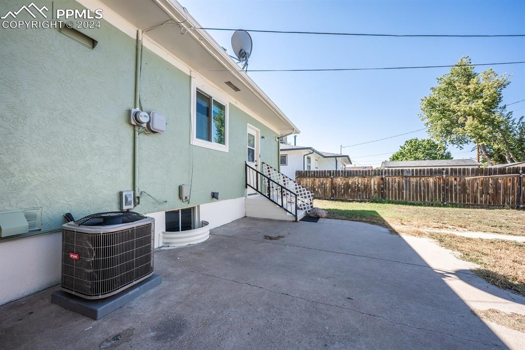 91 Duke Street Pueblo, CO 81005 - Photo 26 of 30 a view of a patio with wooden fence