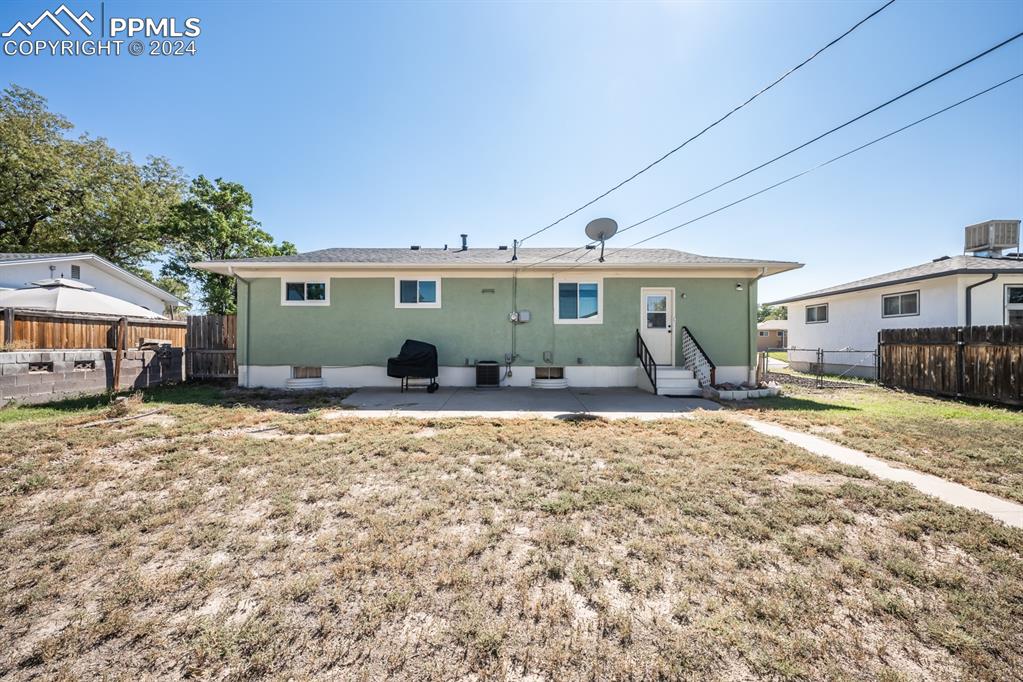 91 Duke Street Pueblo, CO 81005 - Photo 30 of 30 a house view with a backyard space