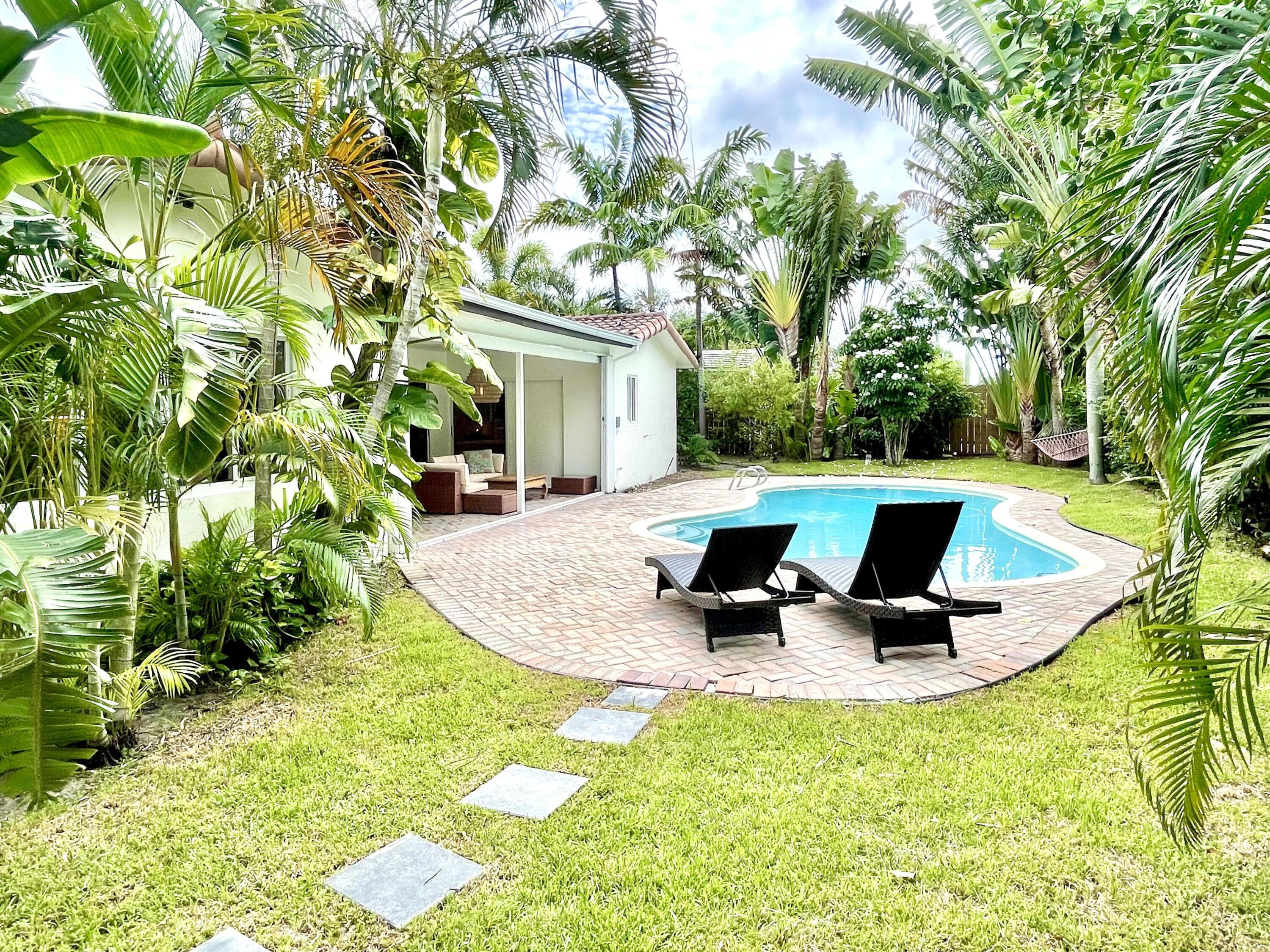 921 Northwest 7th Street Boca Raton, FL 33486 - Photo 18 of 18 a view of a swimming pool with sitting area