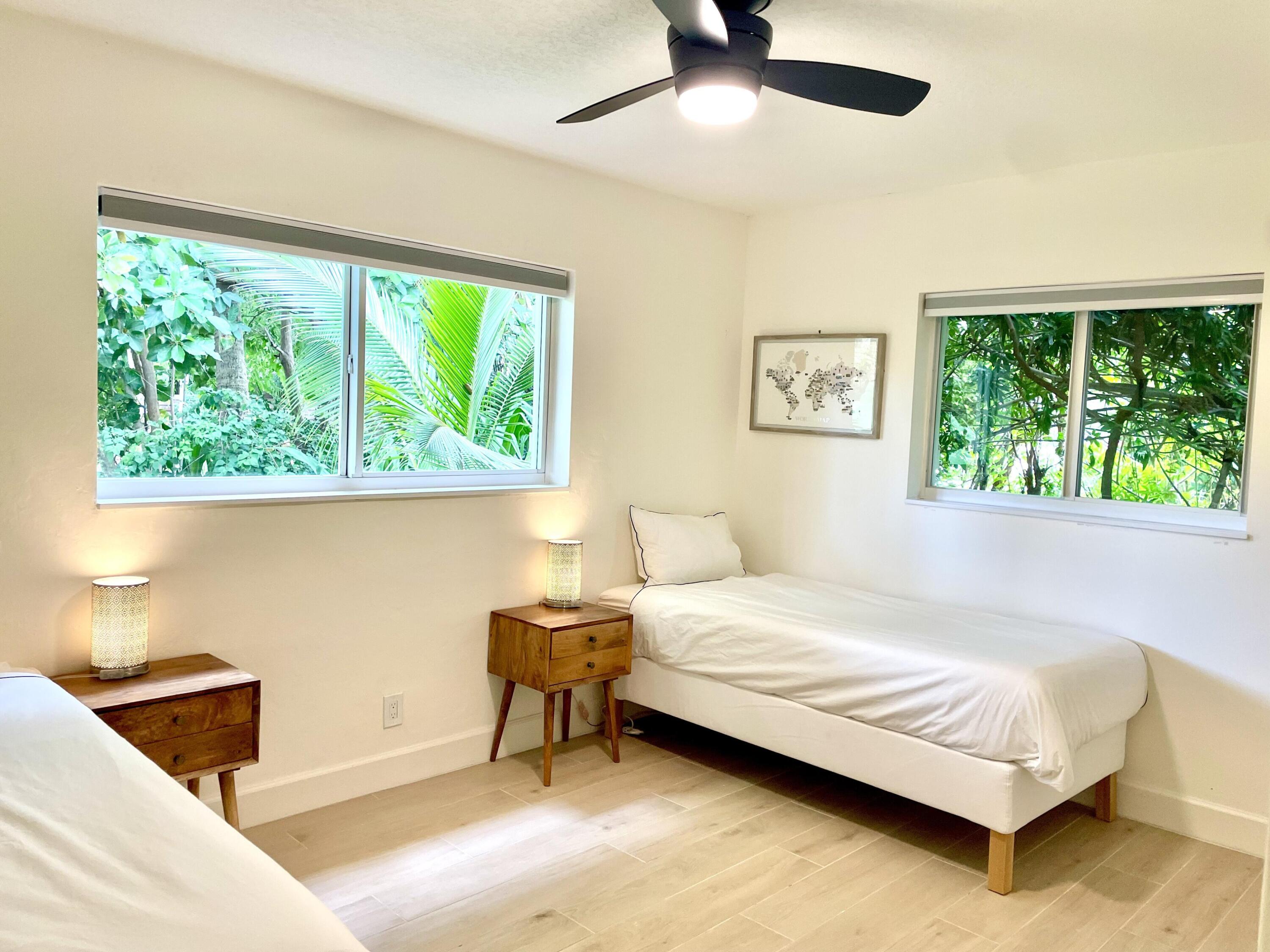 921 Northwest 7th Street Boca Raton, FL 33486 - Photo 10 of 18 a bedroom with a bed and a window