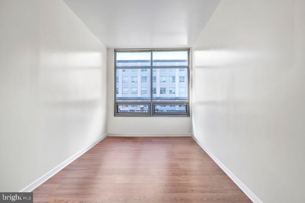 111 North 9th Street, Unit 707 Philadelphia, PA 19107 - Photo 13 of 20 a view of empty room with wooden floor and fan