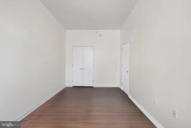 an empty room with wooden floor