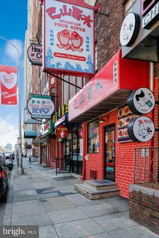 a view of a cafe with sitting area