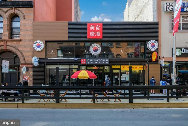 a view of a building with sitting area