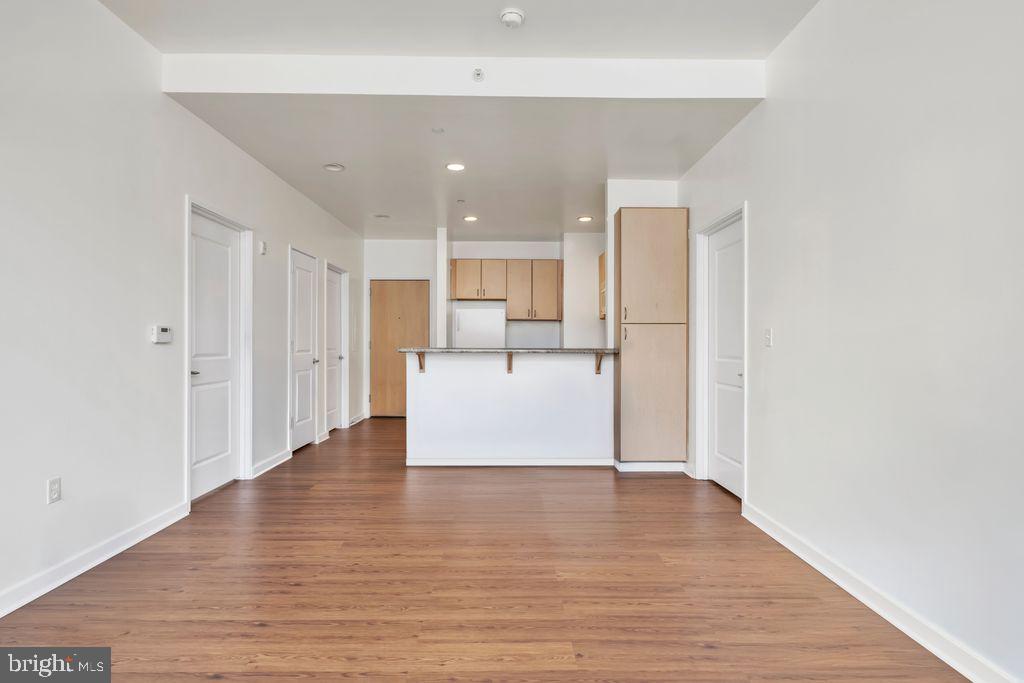 111 North 9th Street, Unit 707 Philadelphia, PA 19107 - Photo 5 of 20 a view of a kitchen with wooden floor