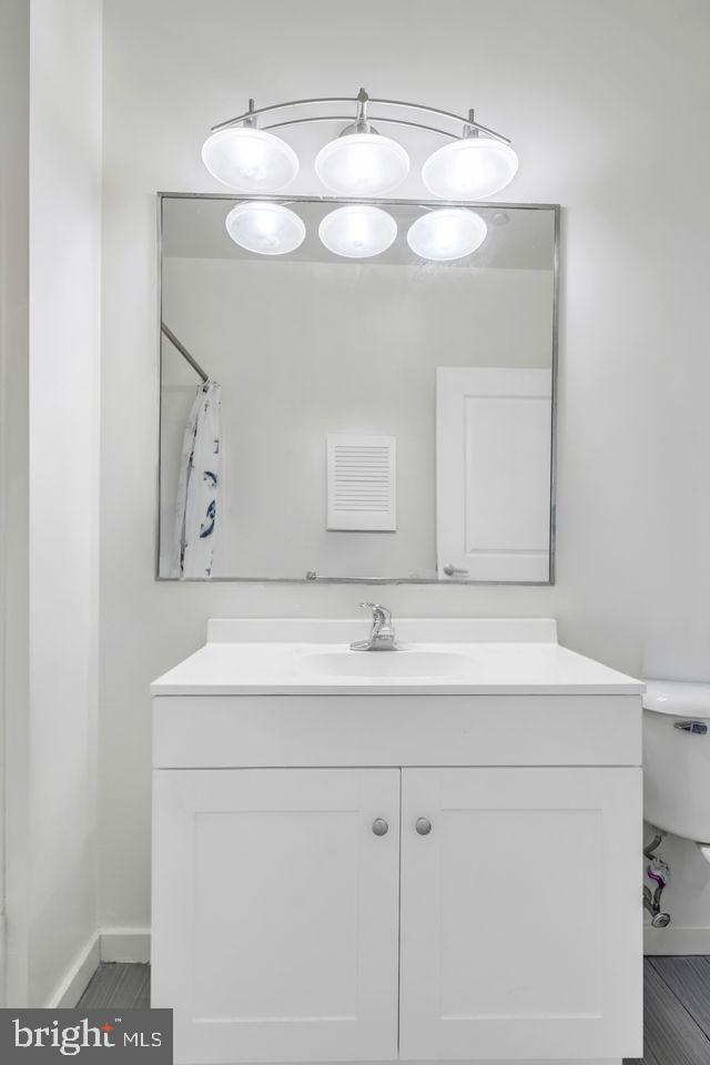 111 North 9th Street, Unit 707 Philadelphia, PA 19107 - Photo 7 of 20 a bathroom with a sink and a mirror