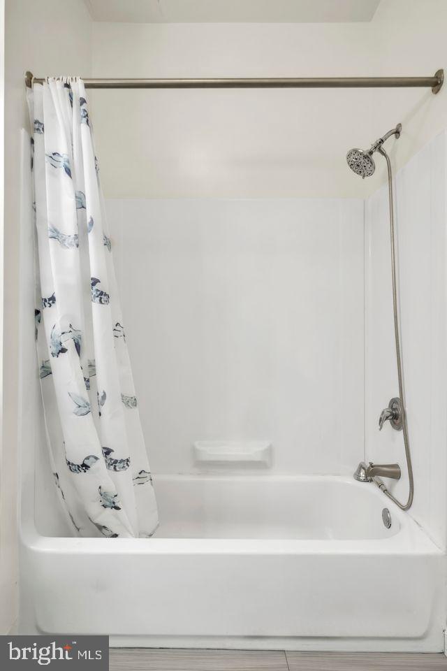 111 North 9th Street, Unit 707 Philadelphia, PA 19107 - Photo 10 of 20 a bathroom with a bathtub and a shower