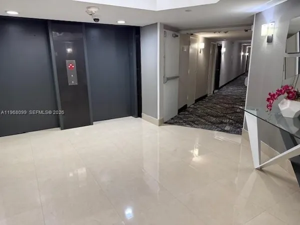 a large white bathroom with a shower