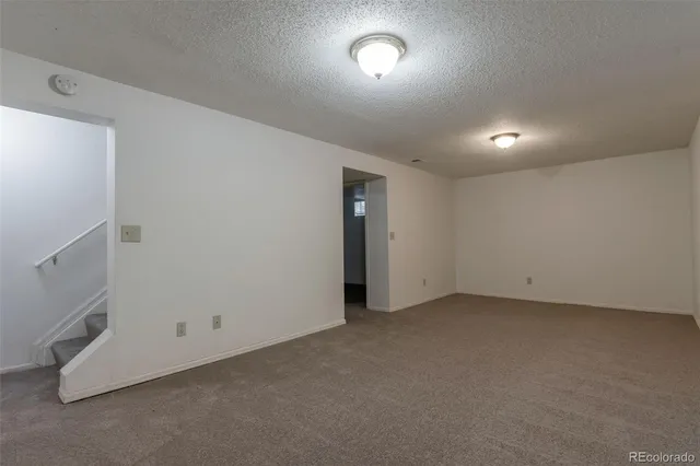 an empty room with white walls and white walls