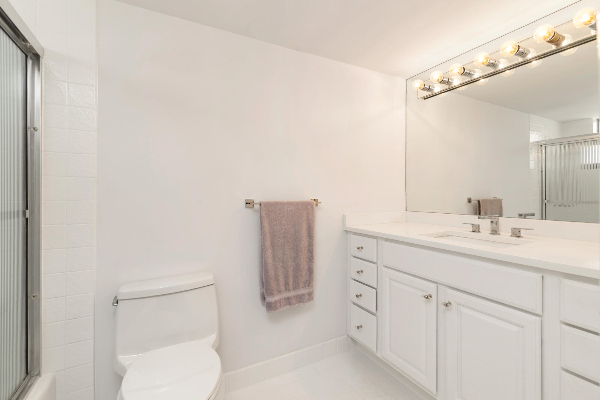 2860 South Ocean Boulevard, Unit 511 Palm Beach, FL 33480 - Photo 11 of 22 a bathroom with a sink a toilet and vanity