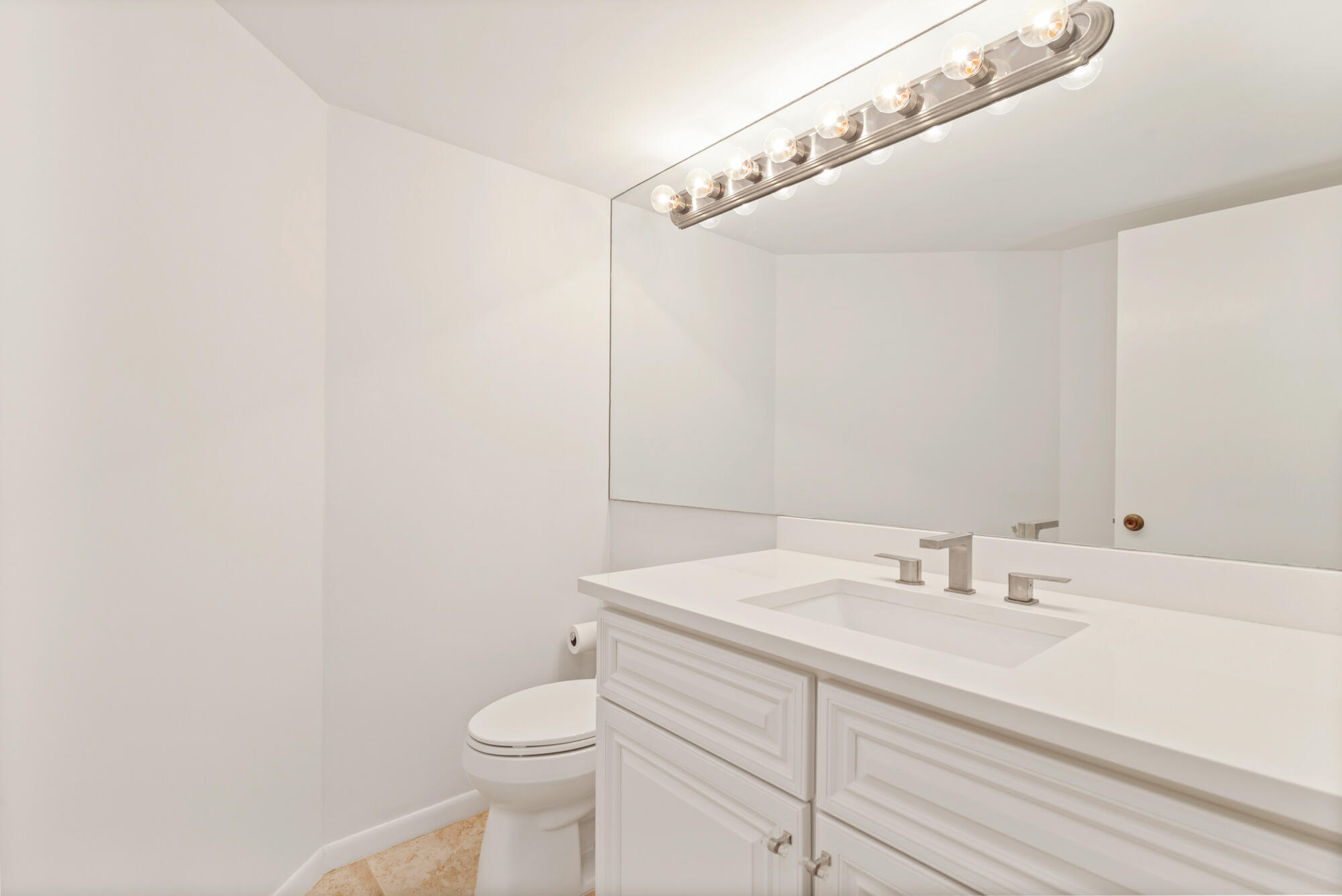 2860 South Ocean Boulevard, Unit 511 Palm Beach, FL 33480 - Photo 13 of 22 a bathroom with a sink a toilet and vanity