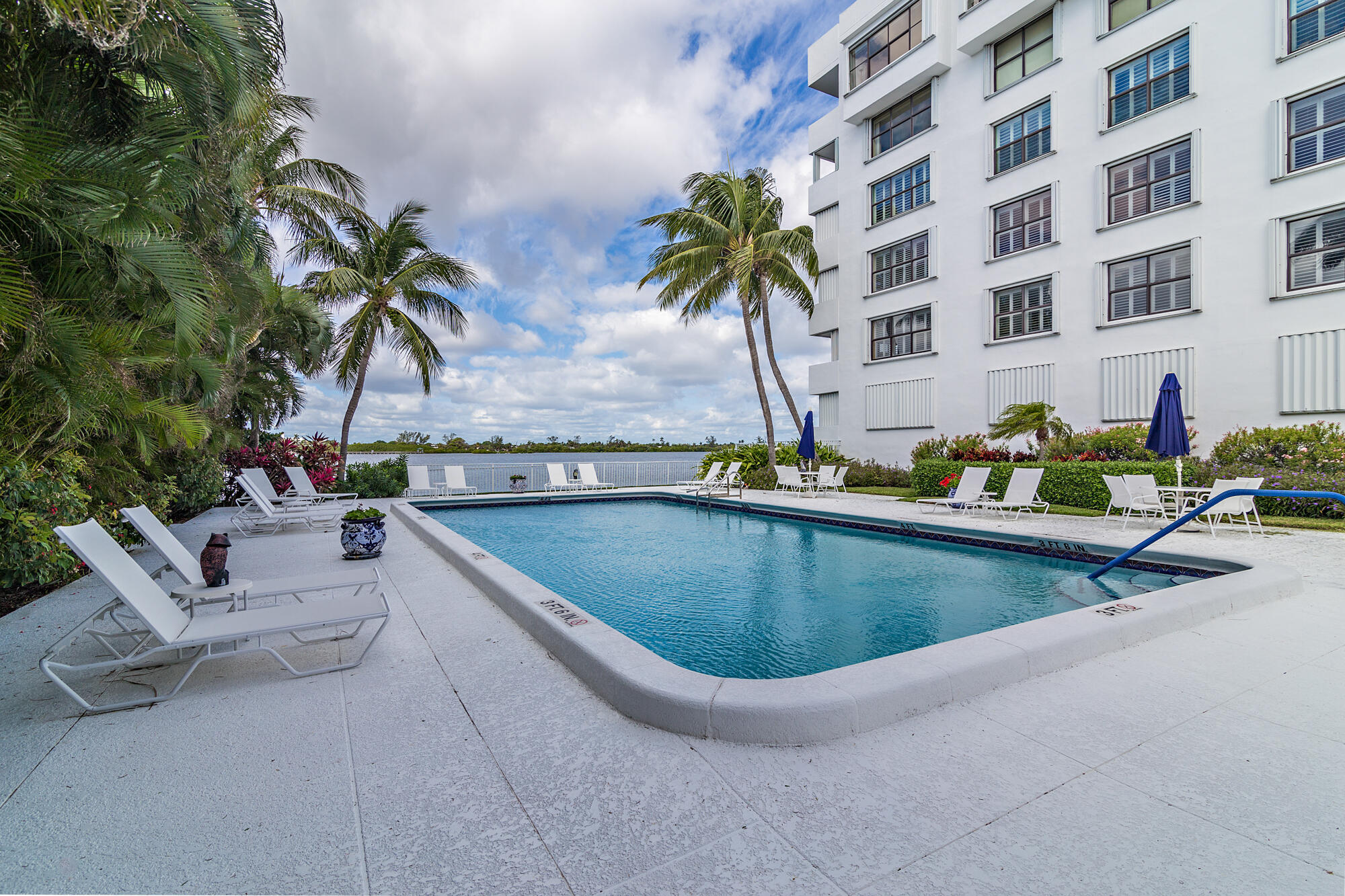 2860 South Ocean Boulevard, Unit 511 Palm Beach, FL 33480 - Photo 18 of 22 a view of a swimming pool with a lounge chair