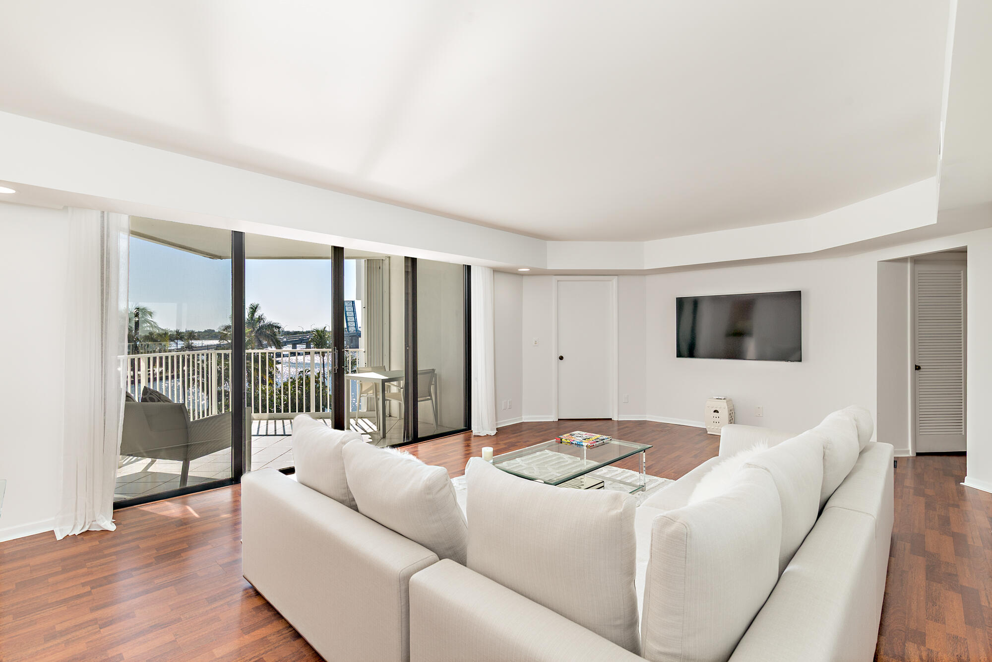 2860 South Ocean Boulevard, Unit 511 Palm Beach, FL 33480 - Photo 2 of 22 a living room with furniture and a floor to ceiling window