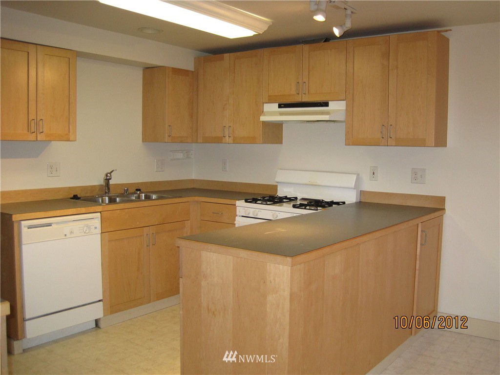 3725 Rockefeller Avenue Everett, WA 98201 - Photo 17 of 24 a kitchen with a sink and cabinets