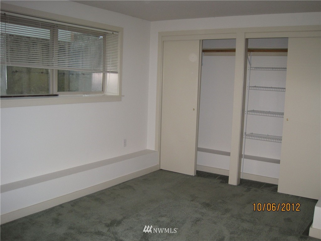 3725 Rockefeller Avenue Everett, WA 98201 - Photo 18 of 24 wooden floor with cabinet